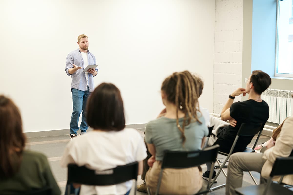 A man giving a presentation to a group of people.